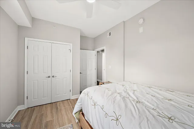 a bed room with a bed and a view of bedroom