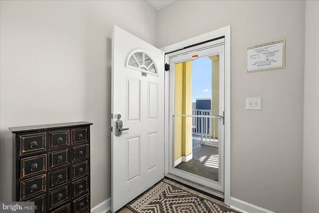 a view of front door with wooden floor