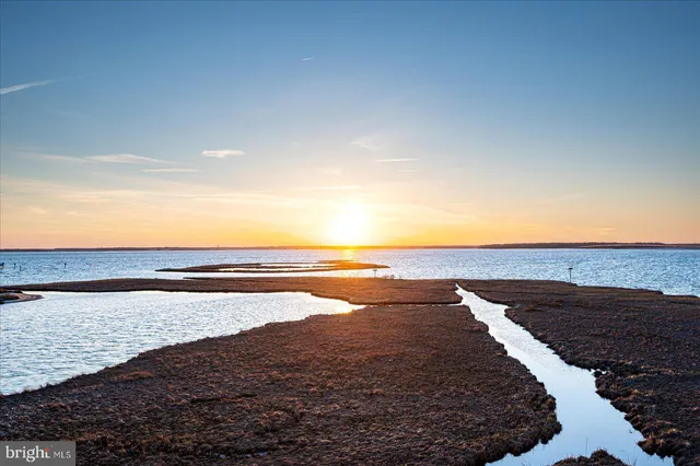 a sunset view with a lake view