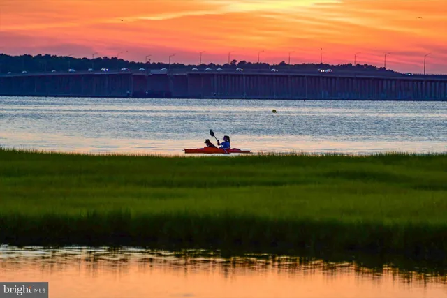 a view of a lake with a yard