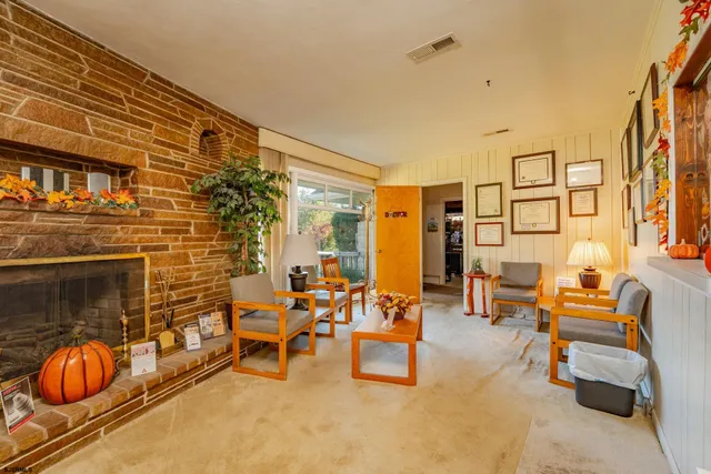 a outdoor space with patio furniture and a fireplace