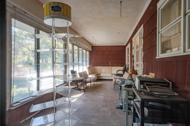 a view of walk in closet with clothes