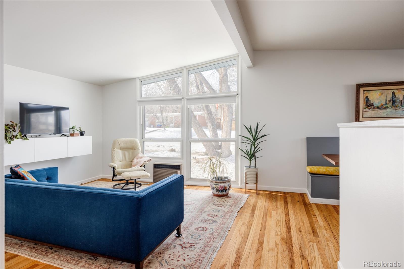 2630 South Perry Street Denver, CO 80219 - Photo 12 of 26 a living room with furniture and a window