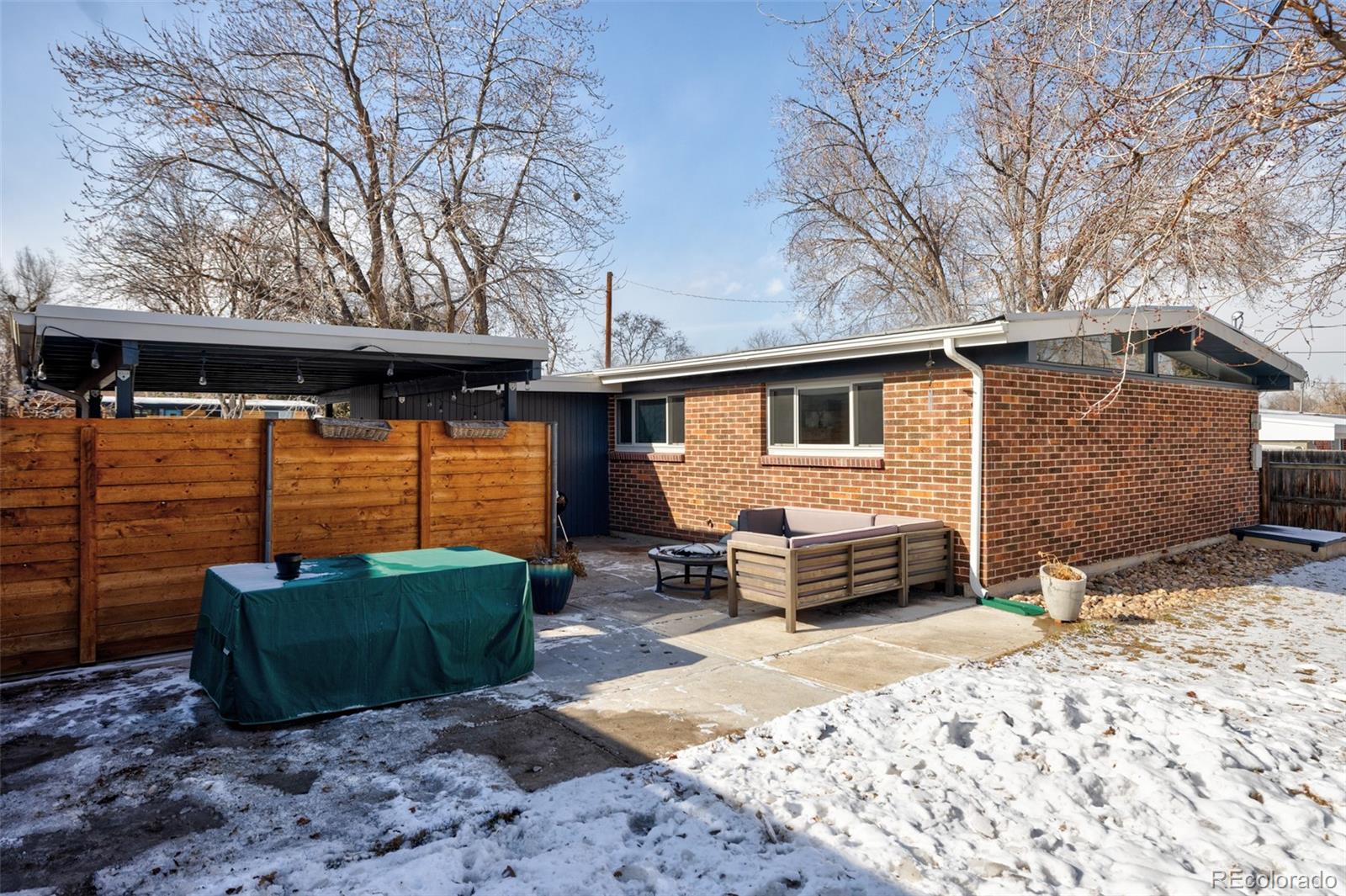 2630 South Perry Street Denver, CO 80219 - Photo 23 of 26 a front view of a house with a yard