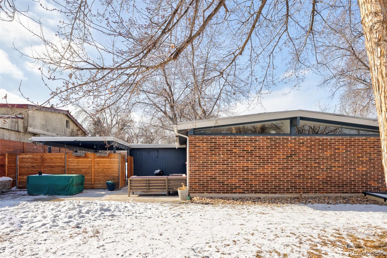 2630 South Perry Street Denver, CO 80219 - Photo 24 of 26 a front view of a house with a yard
