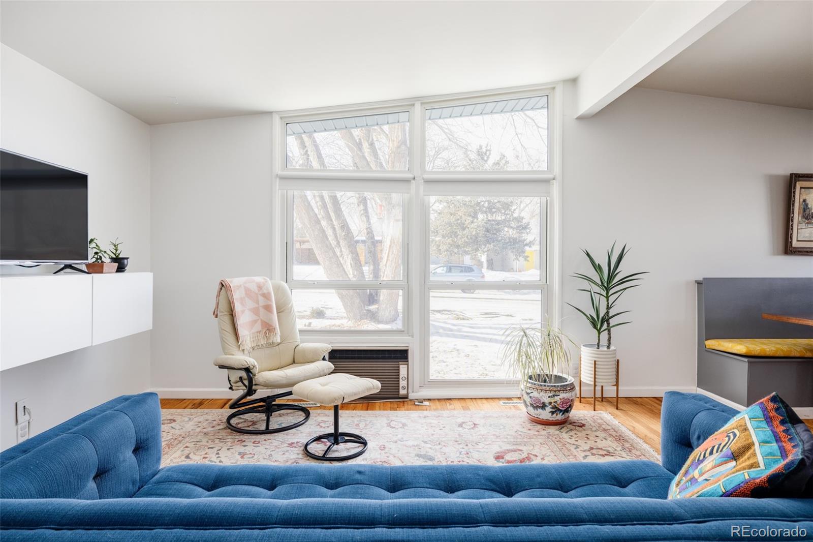 2630 South Perry Street Denver, CO 80219 - Photo 4 of 26 a living room with furniture and a window