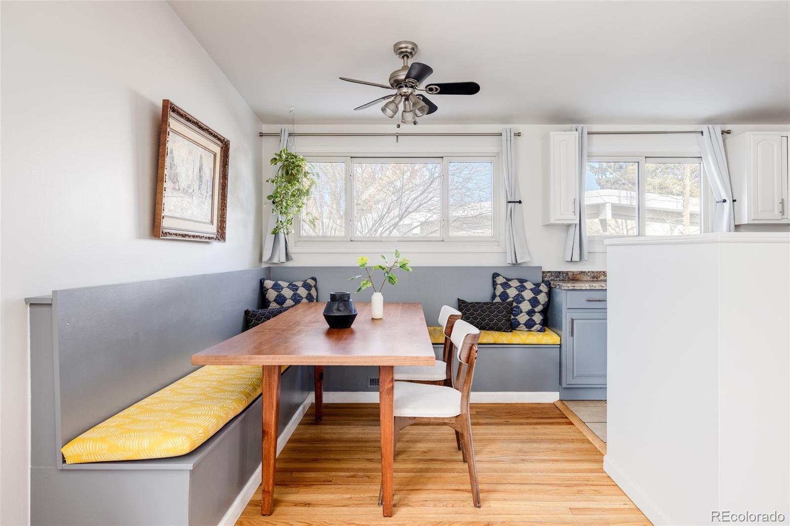 2630 South Perry Street Denver, CO 80219 - Photo 7 of 26 a view of a dining room with furniture window and wooden floor