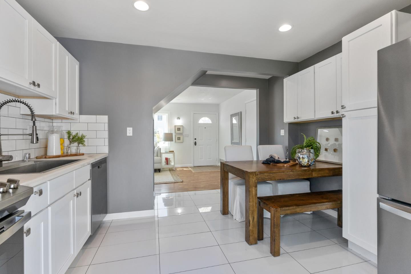551 Inverness Drive Pacifica, CA 94044 - Photo 16 of 37 a view of kitchen with kitchen island stainless steel appliances refrigerator stove microwave and cabinets