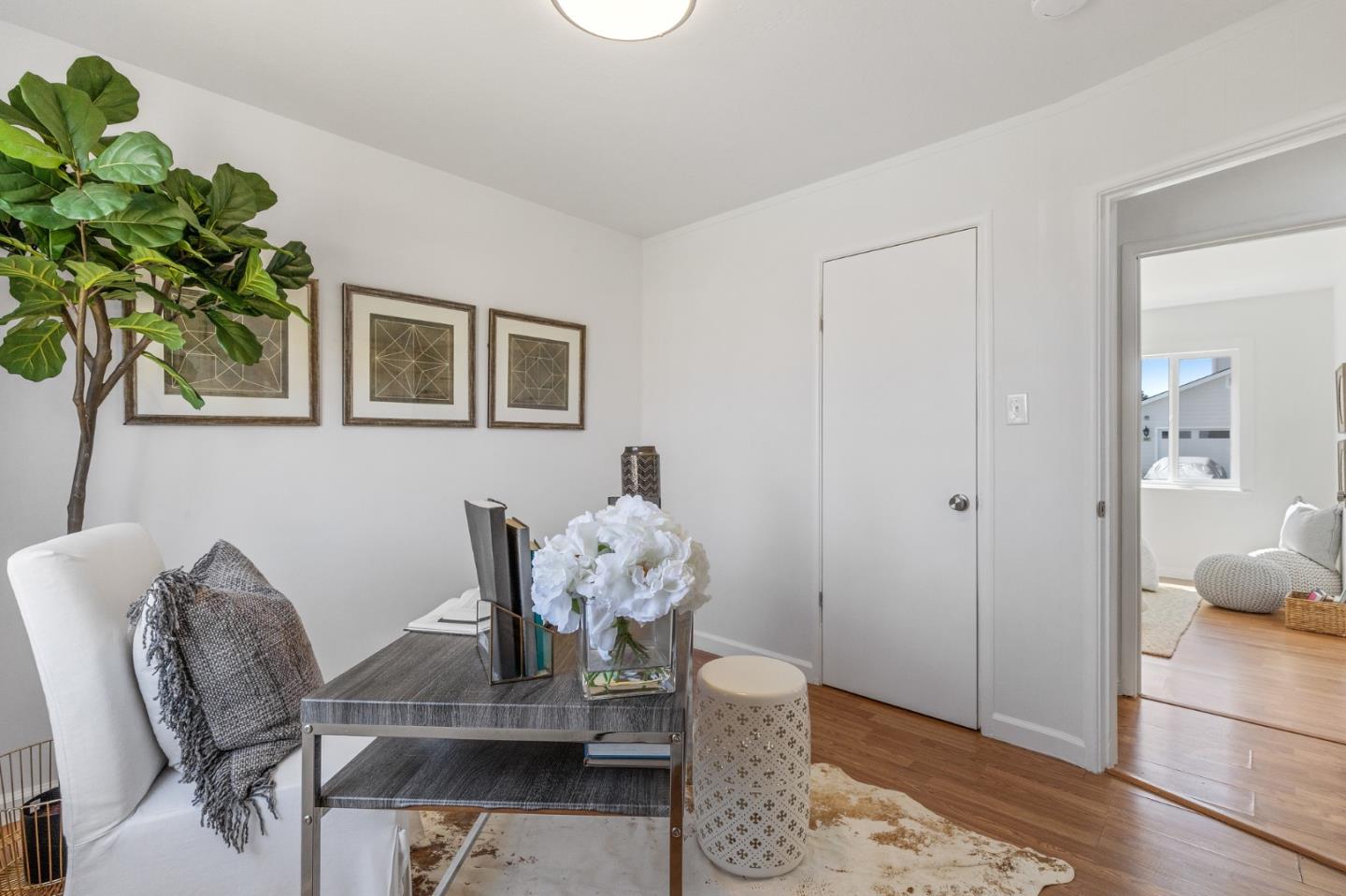 551 Inverness Drive Pacifica, CA 94044 - Photo 18 of 37 a dining room with furniture and wooden floor