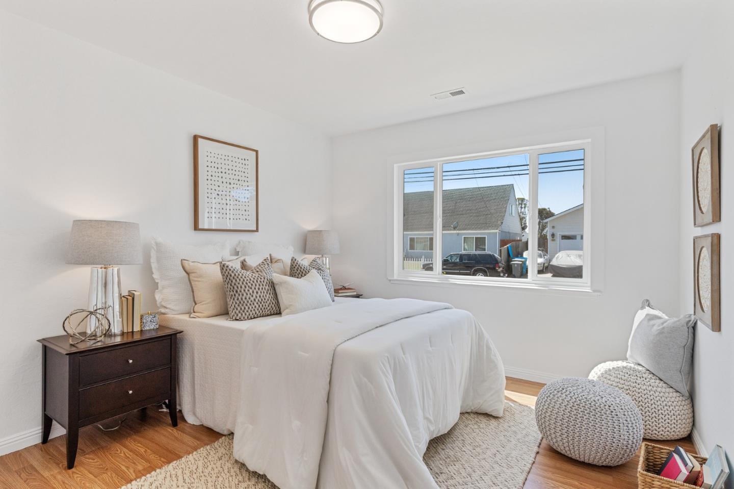 551 Inverness Drive Pacifica, CA 94044 - Photo 19 of 37 a bedroom with bed and window