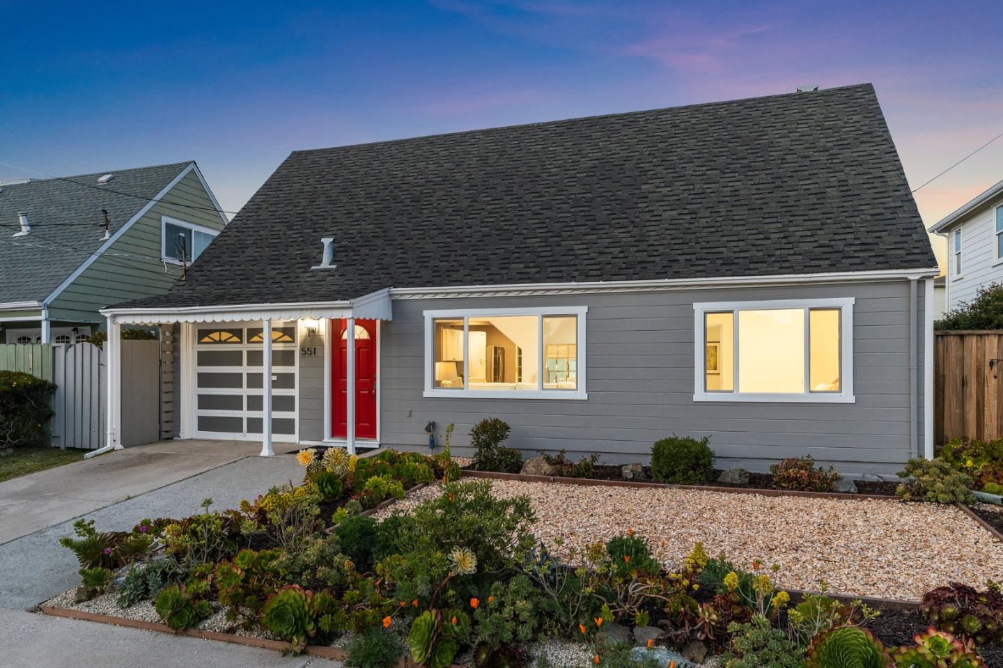 551 Inverness Drive Pacifica, CA 94044 - Photo 2 of 37 a front view of house with yard and trees in the background