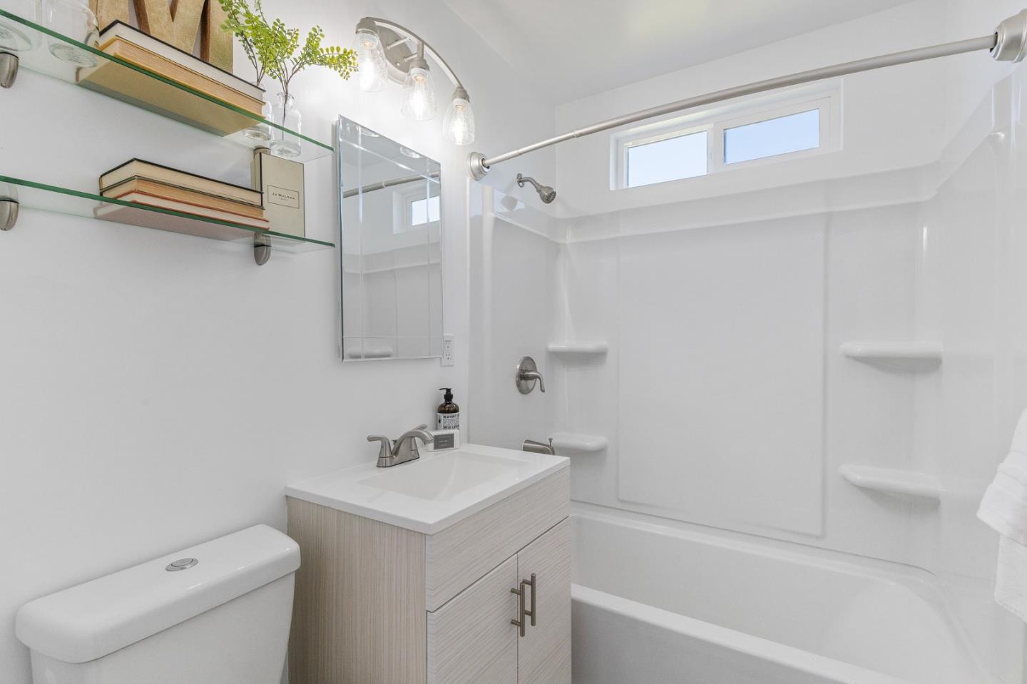 551 Inverness Drive Pacifica, CA 94044 - Photo 21 of 37 a bathroom with a sink a toilet and a bathtub
