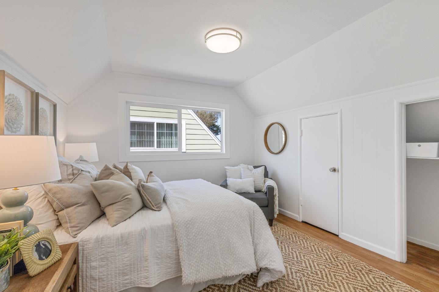 551 Inverness Drive Pacifica, CA 94044 - Photo 23 of 37 a bedroom with a bed and window