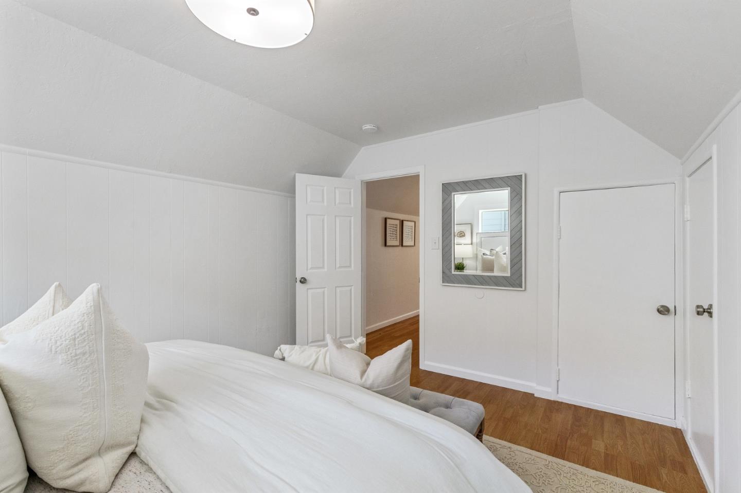 551 Inverness Drive Pacifica, CA 94044 - Photo 26 of 37 a bedroom with a bed and glass door