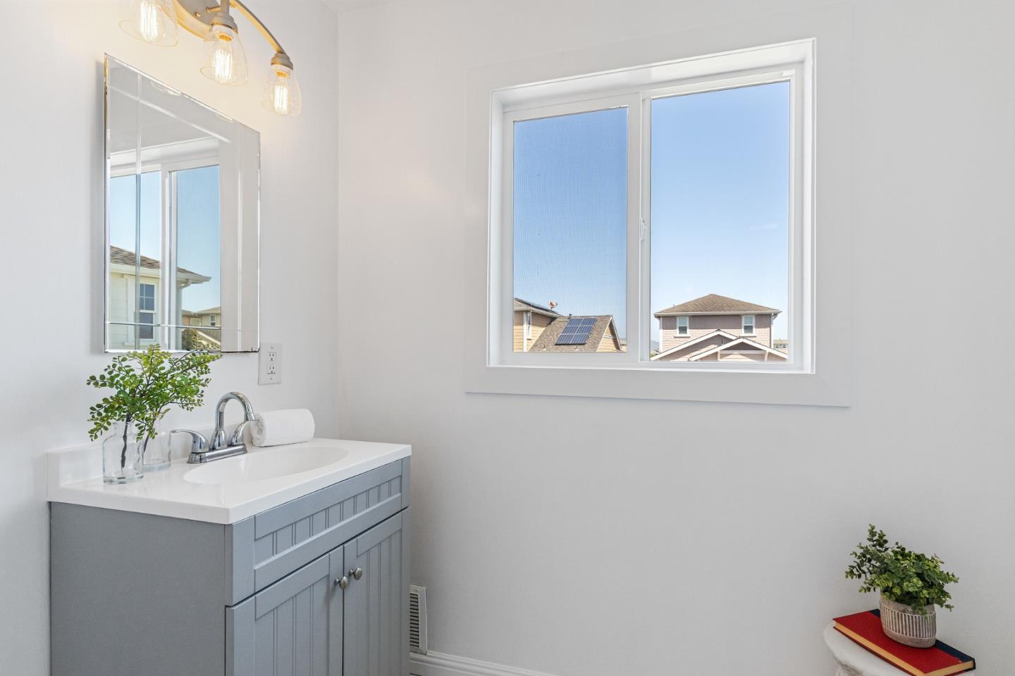 551 Inverness Drive Pacifica, CA 94044 - Photo 28 of 37 a bathroom with a sink and a mirror