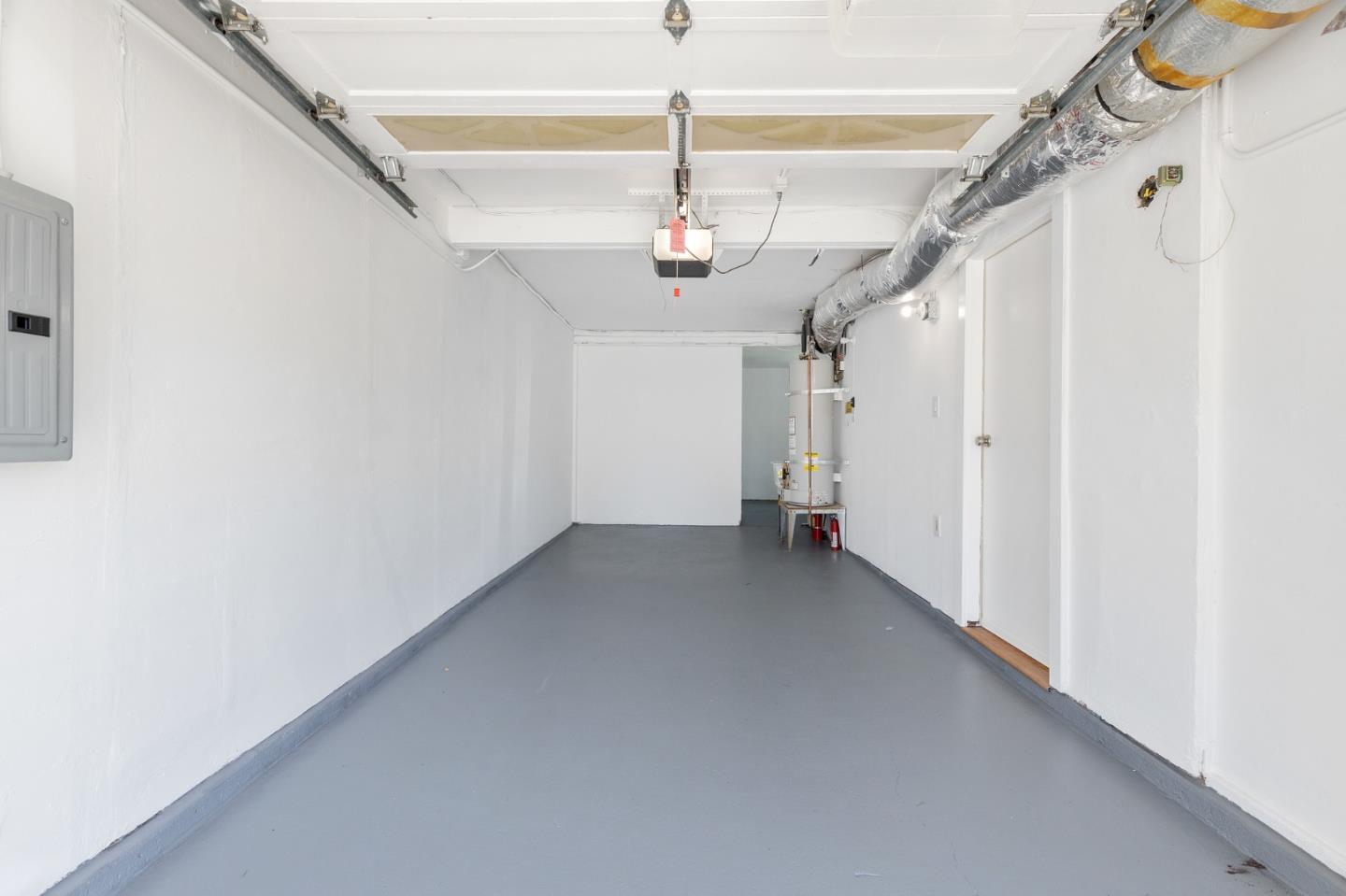 551 Inverness Drive Pacifica, CA 94044 - Photo 29 of 37 a view of a hallway with a white walls