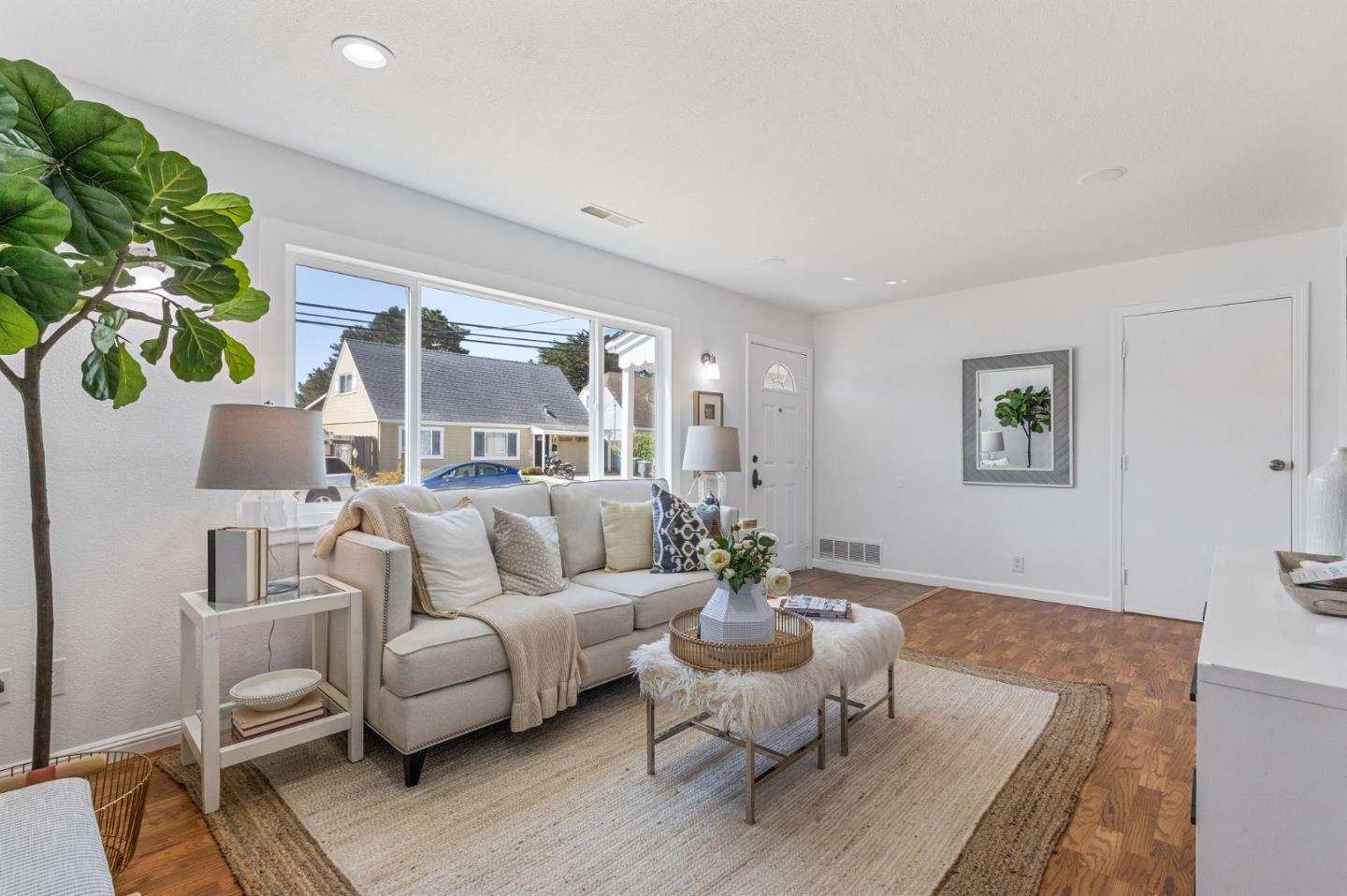 551 Inverness Drive Pacifica, CA 94044 - Photo 7 of 37 a living room with furniture and a potted plant