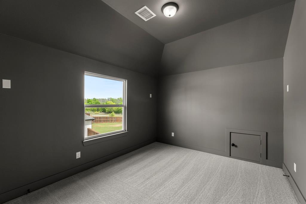 941 Gold Finch Lane Forney, TX 75126 - Photo 24 of 27 an empty room with windows