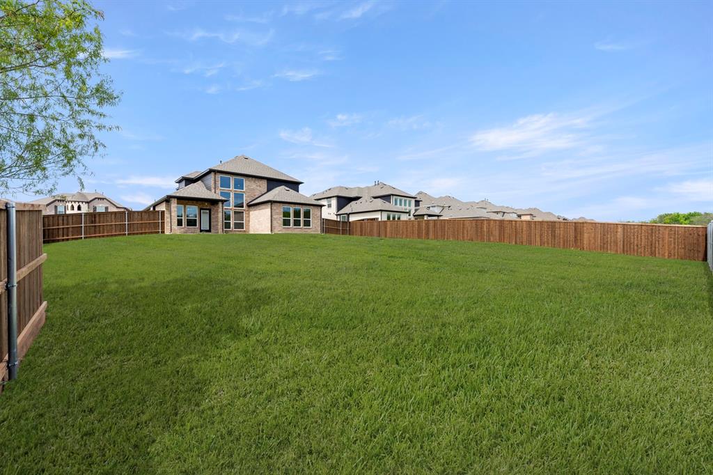 941 Gold Finch Lane Forney, TX 75126 - Photo 27 of 27 a view of a house with a yard
