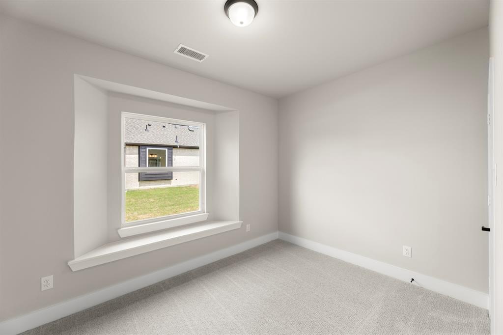 941 Gold Finch Lane Forney, TX 75126 - Photo 4 of 27 an empty room with a window