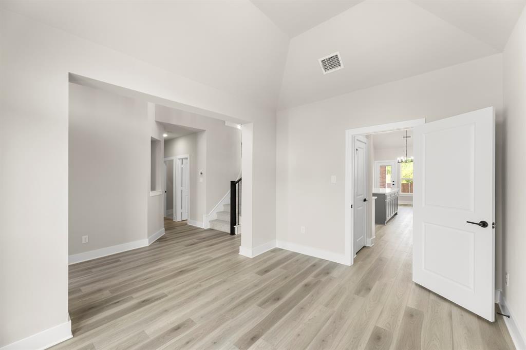 941 Gold Finch Lane Forney, TX 75126 - Photo 6 of 27 a view of a hallway with wooden floor and closet
