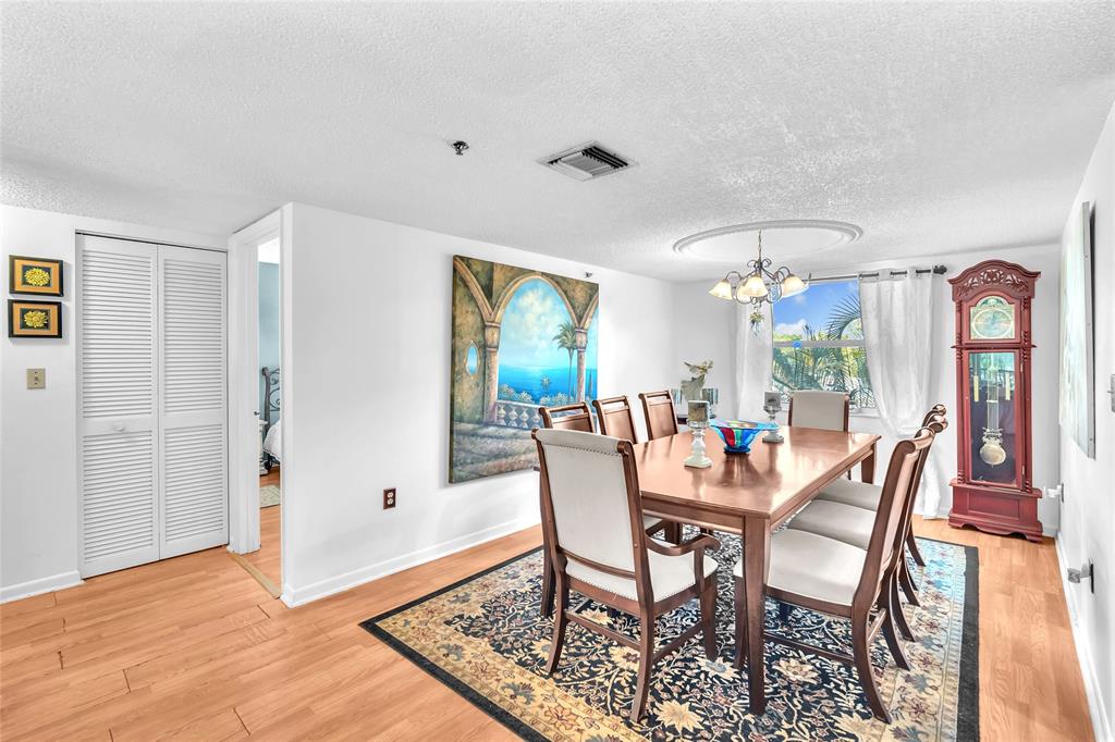 3910 Inverrary Boulevard, Unit 308B Lauderhill, FL 33319 - Photo 27 of 53 a view of a dining room with furniture window and wooden floor