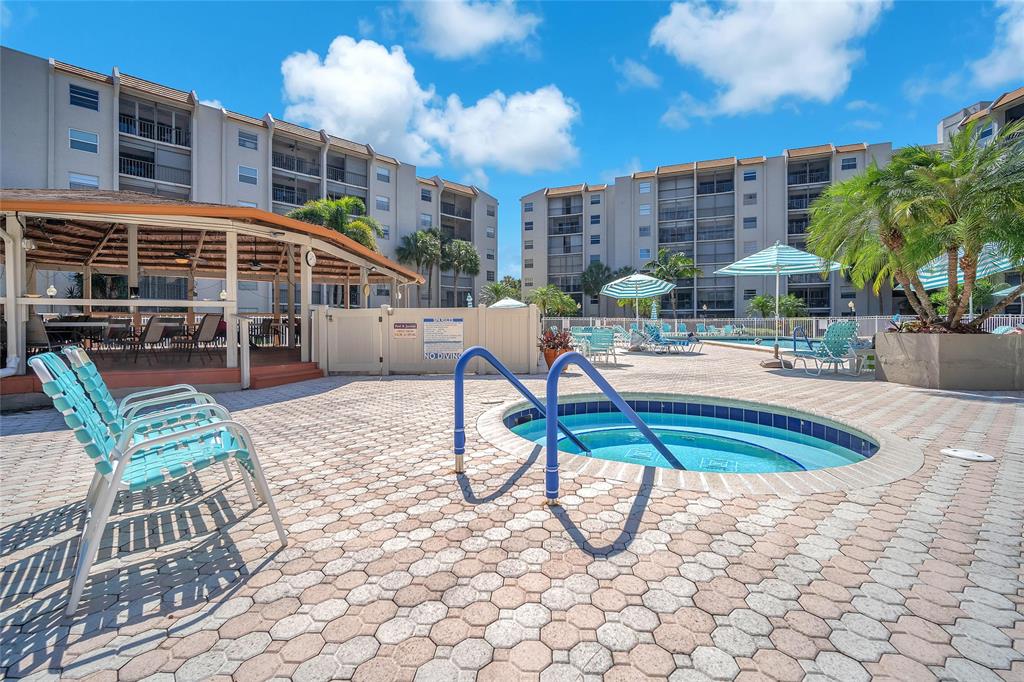 3910 Inverrary Boulevard, Unit 308B Lauderhill, FL 33319 - Photo 41 of 53 a view of a house with swimming pool and sitting area