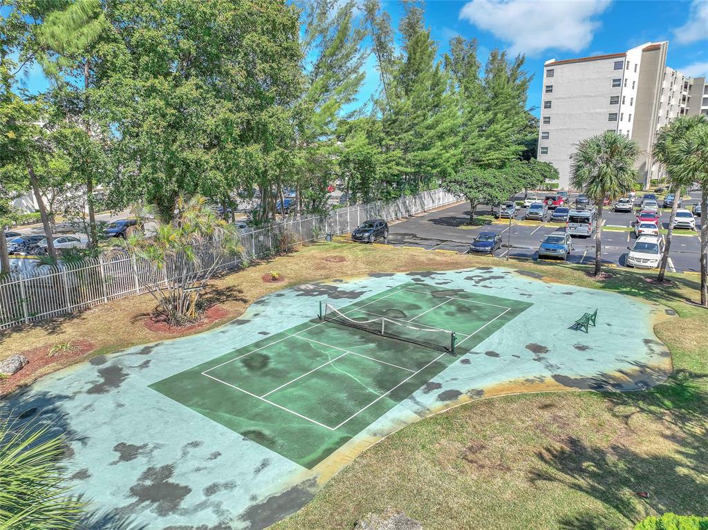 3910 Inverrary Boulevard, Unit 308B Lauderhill, FL 33319 - Photo 44 of 53 a view of a backyard patio and swimming pool