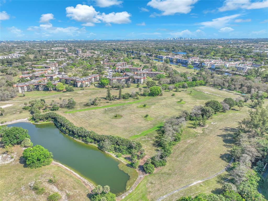 3910 Inverrary Boulevard, Unit 308B Lauderhill, FL 33319 - Photo 46 of 53 a view of a lake with a city