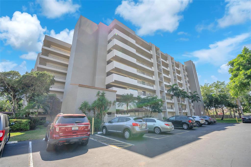 3910 Inverrary Boulevard, Unit 308B Lauderhill, FL 33319 - Photo 47 of 53 a view of a parked cars in front of a building