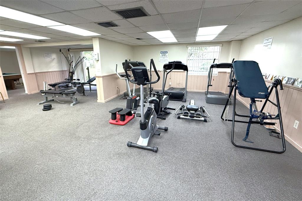 3910 Inverrary Boulevard, Unit 308B Lauderhill, FL 33319 - Photo 49 of 53 a view of a room with gym equipment