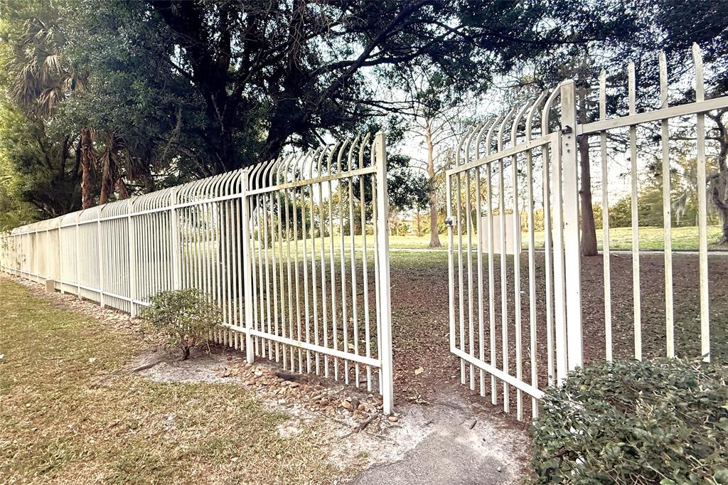 3910 Inverrary Boulevard, Unit 308B Lauderhill, FL 33319 - Photo 53 of 53 a view of a house with a small yard and wooden fence