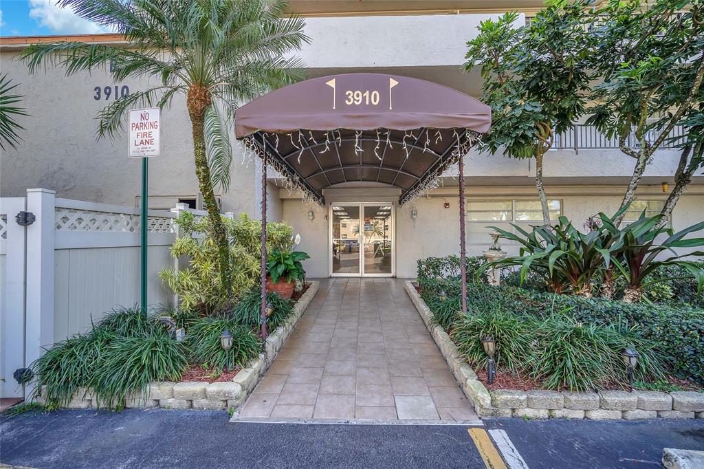 3910 Inverrary Boulevard, Unit 308B Lauderhill, FL 33319 - Photo 10 of 53 a front view of a house with garden