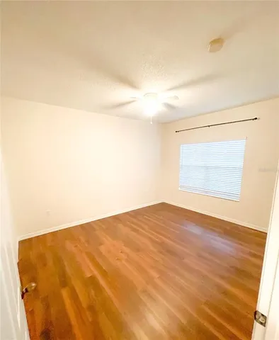 a view of an entryway with wooden floor