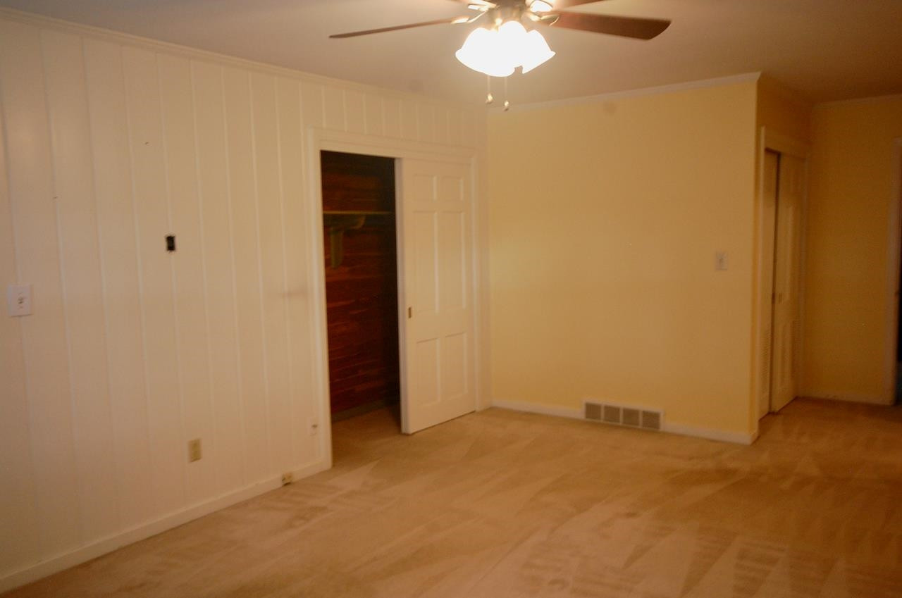 605 South Trenton Street Rutherford, TN 38369 - Photo 23 of 39 an empty room with a chandelier fan