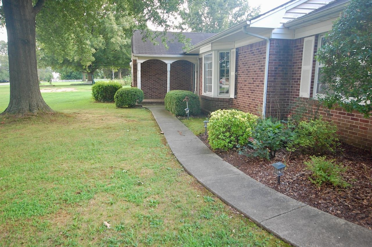 605 South Trenton Street Rutherford, TN 38369 - Photo 35 of 39 a front view of a house with garden and trees