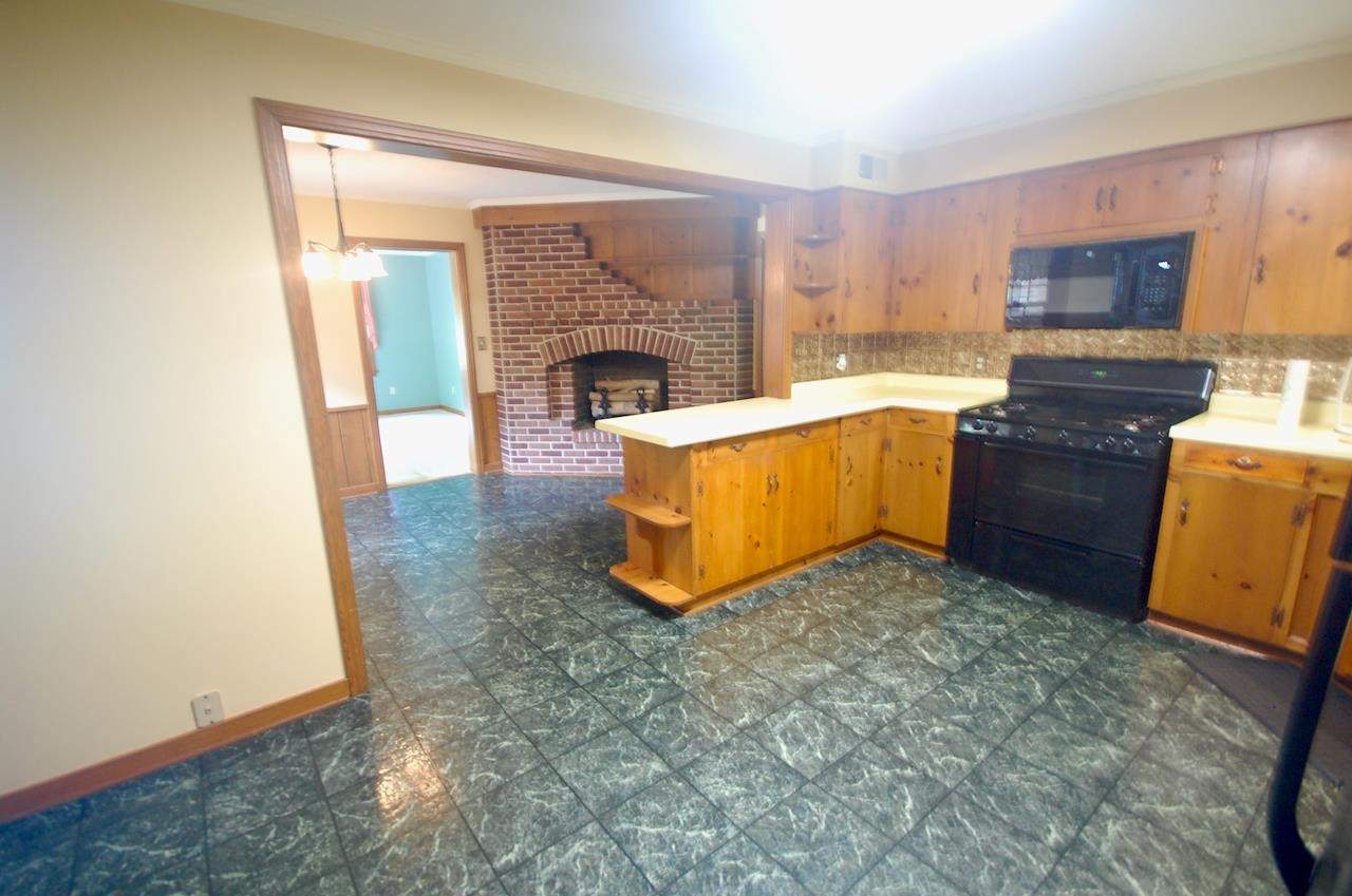 605 South Trenton Street Rutherford, TN 38369 - Photo 4 of 39 a kitchen with granite countertop a stove top oven and sink