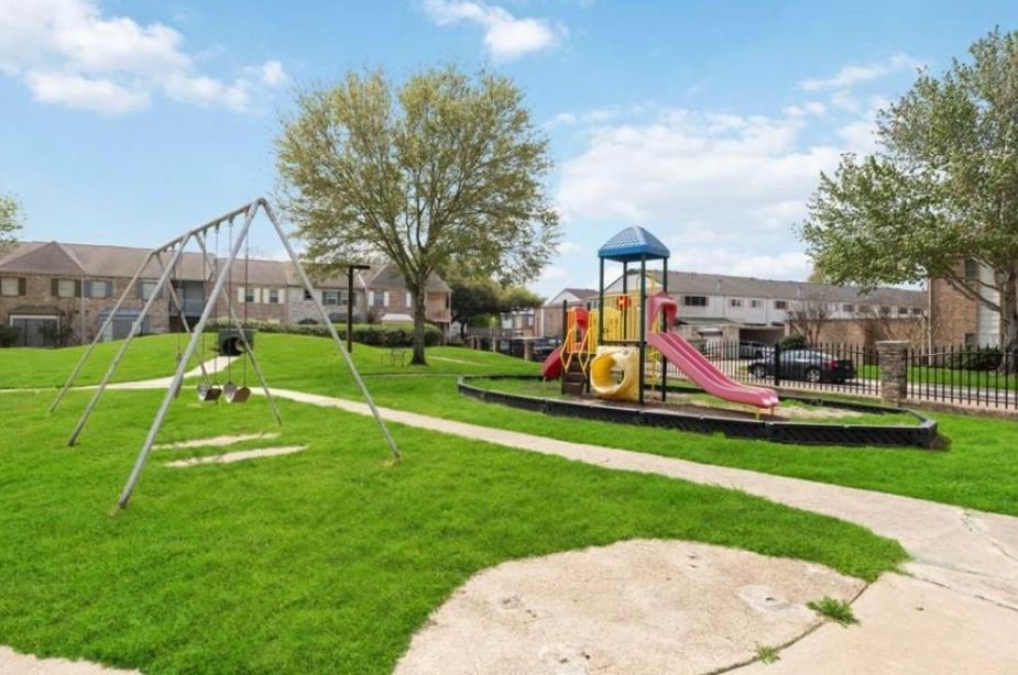 8351 Ariel Street Houston, TX 77074 - Photo 10 of 10 a view of a park with swings and slides