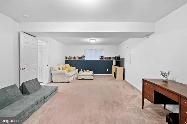 a living room with furniture and a table