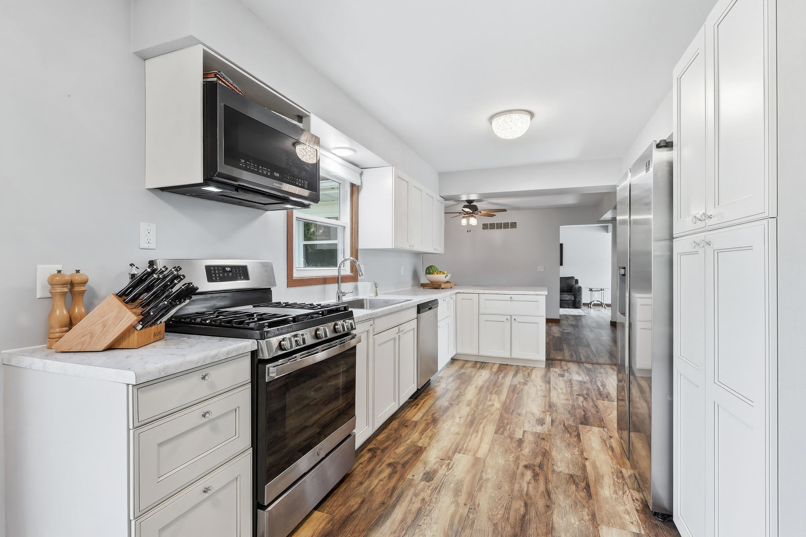 4314 Spring Street Davenport, IA 52807 - Photo 14 of 51 a kitchen with stainless steel appliances granite countertop a stove and a refrigerator