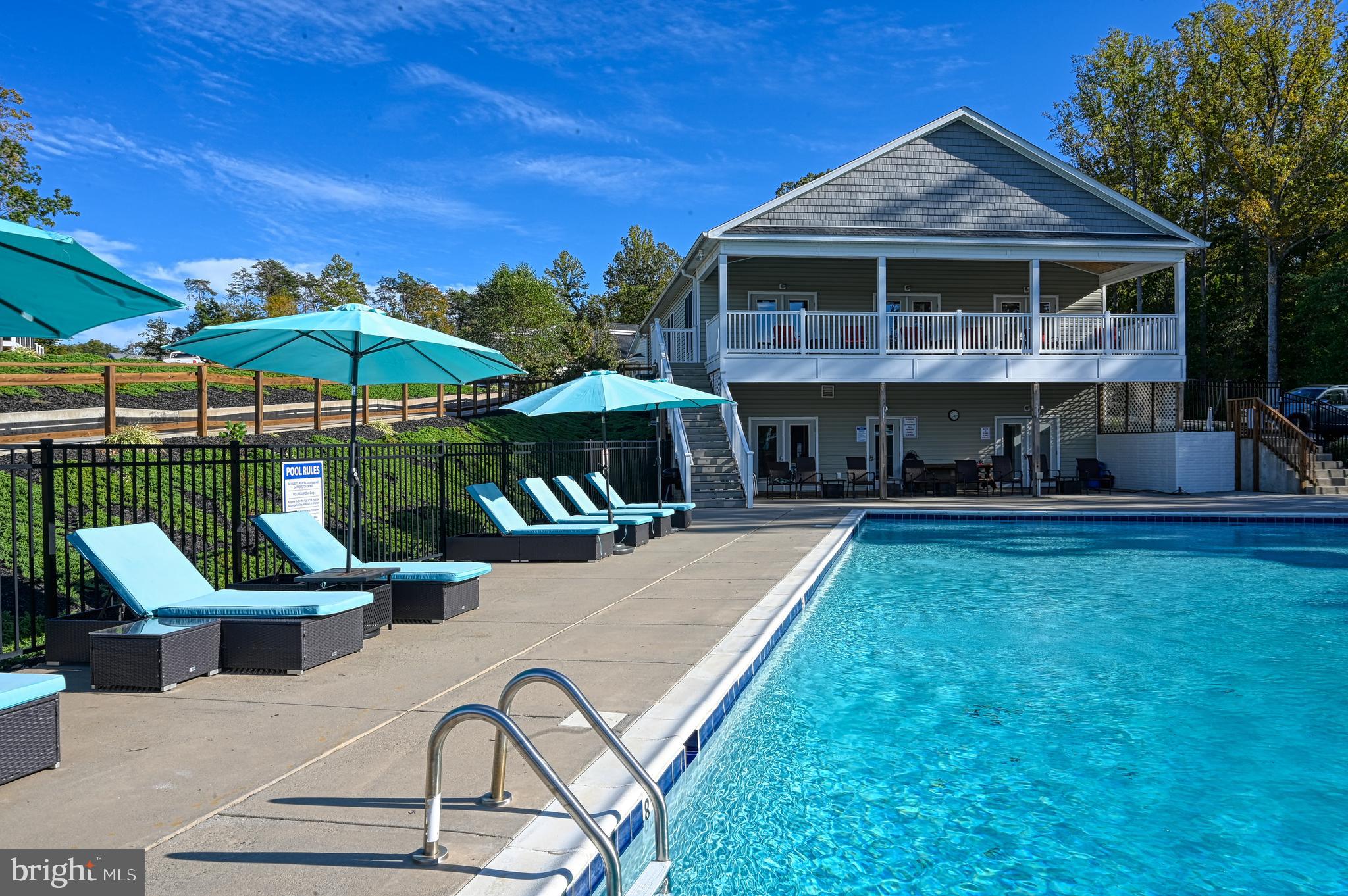 Lot 47 Sunset Loop Mineral, VA 23117 - Photo 11 of 51 a view of a house with a swimming pool and sitting area