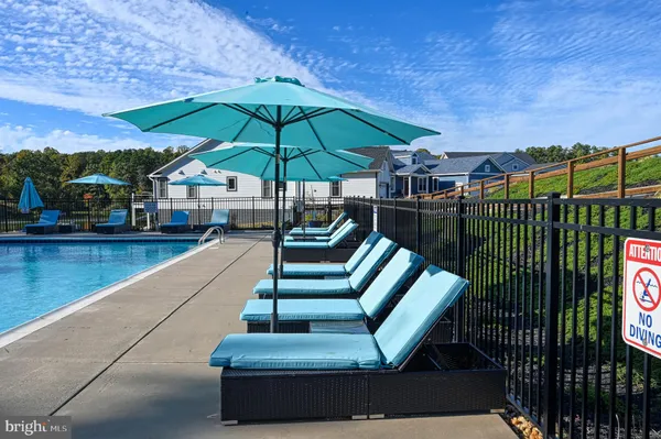 a view of staircase with umbrella and trees