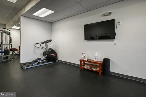 a view of a livingroom with gym equipment