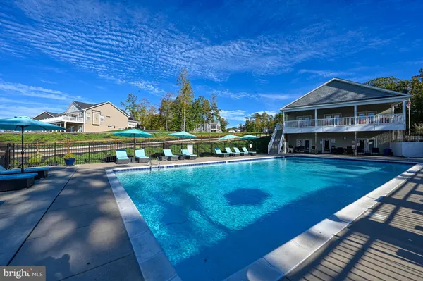 a view of a big house with a big yard