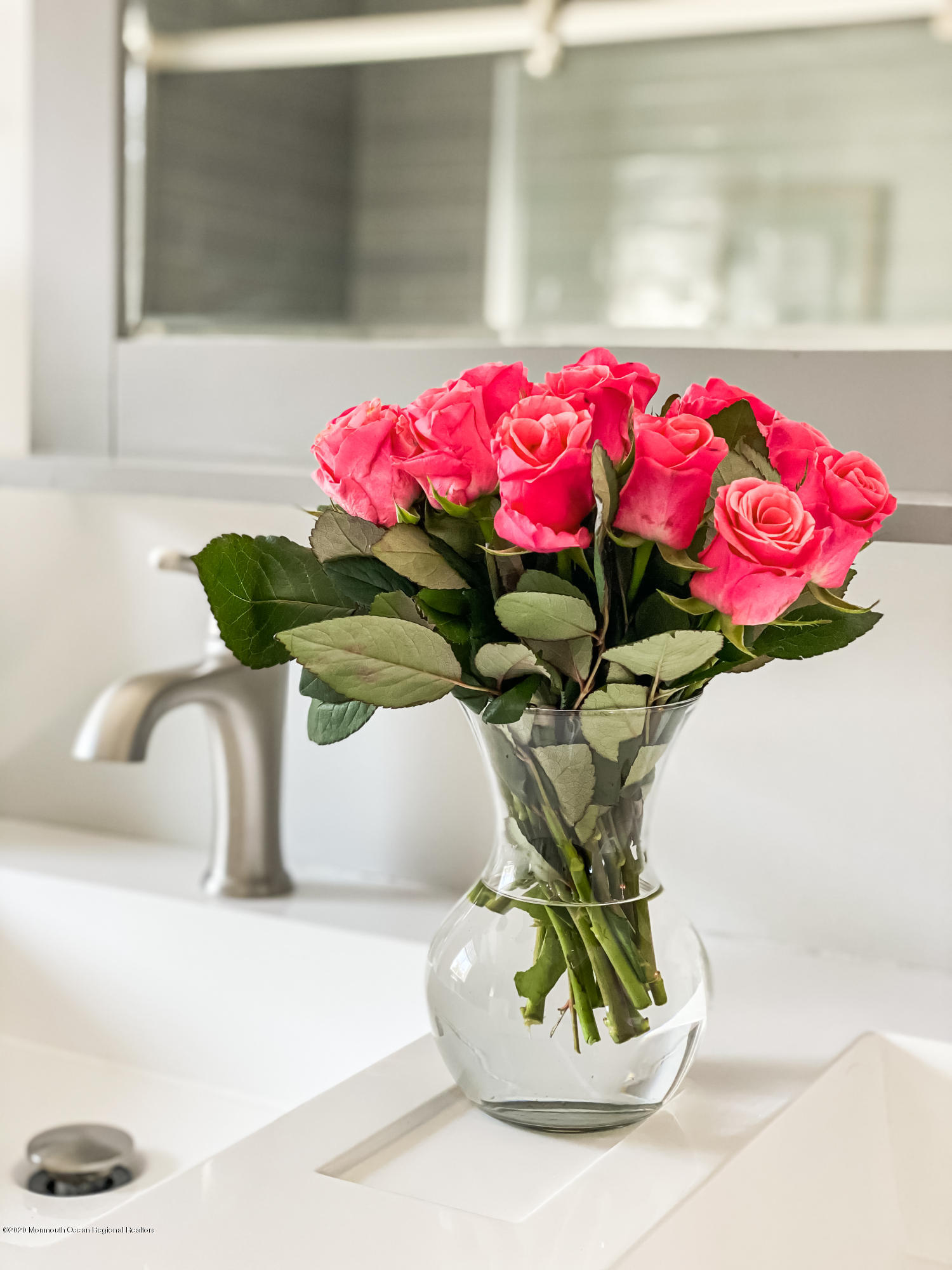 405 Salem Avenue Spring Lake, NJ 07762 - Photo 24 of 44 a vase of flowers sitting on a table