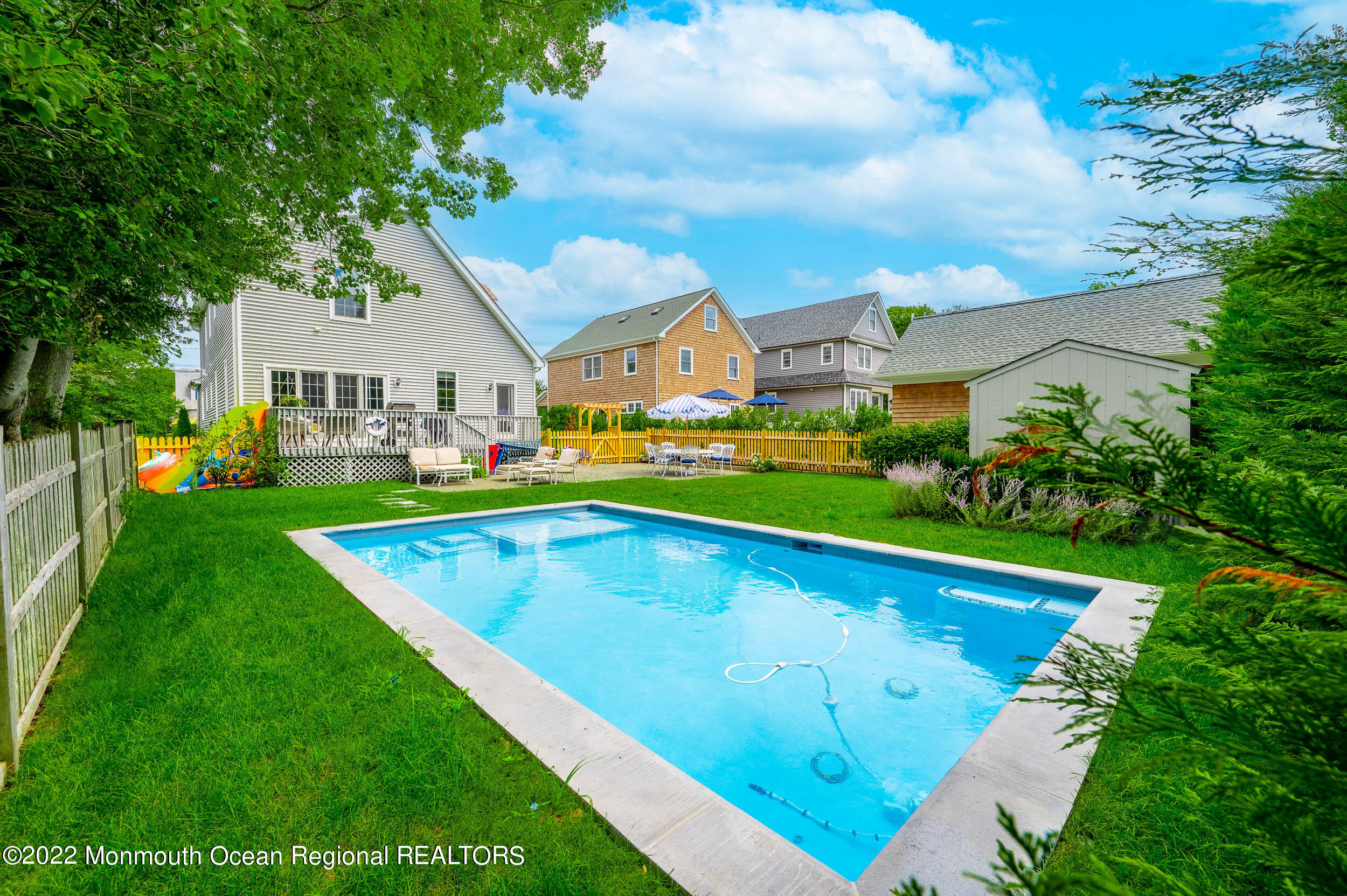 405 Salem Avenue Spring Lake, NJ 07762 - Photo 30 of 44 a view of an house with swimming pool and yard
