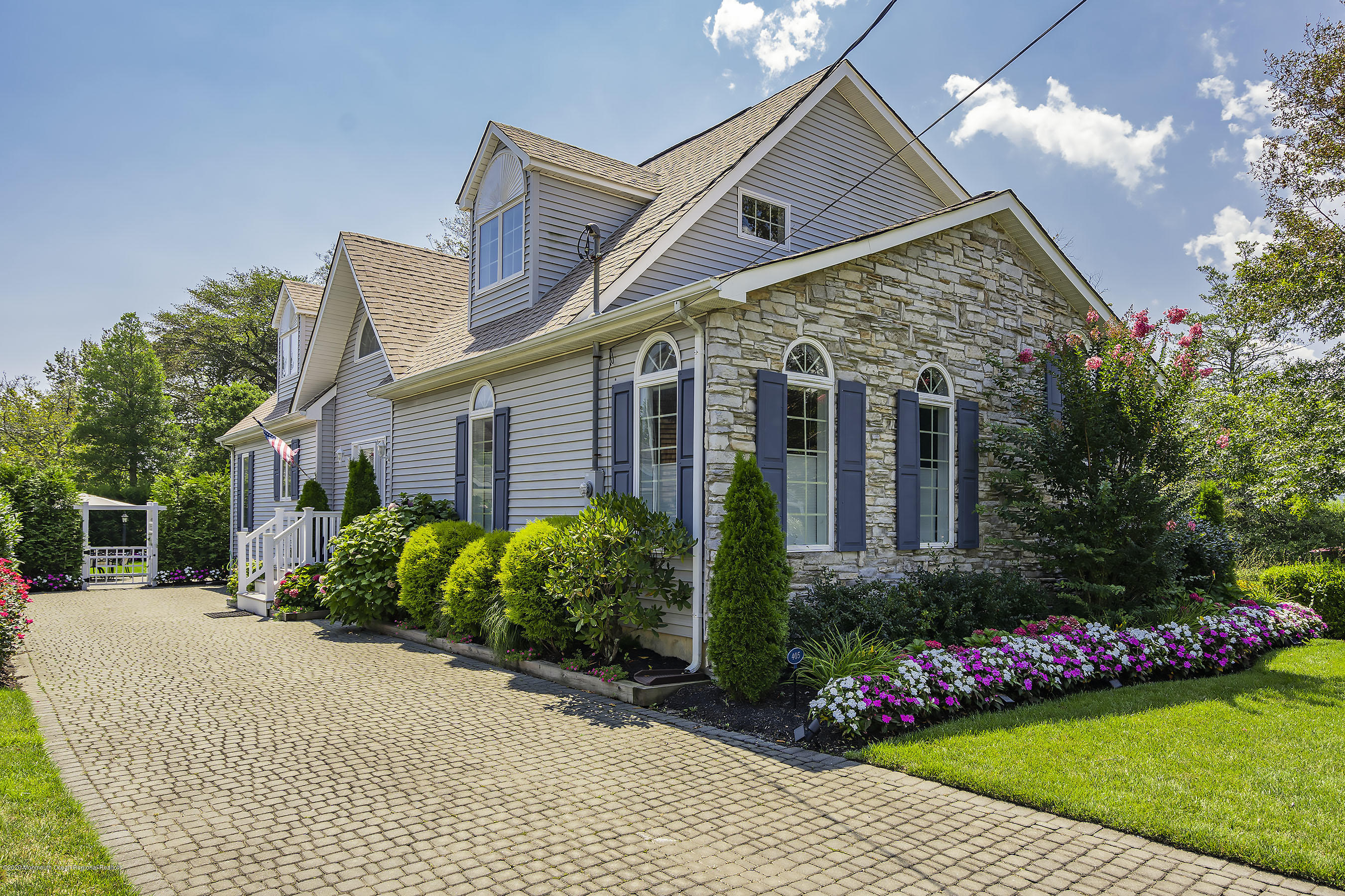 405 Salem Avenue Spring Lake, NJ 07762 - Photo 39 of 44 a front view of a house with a garden