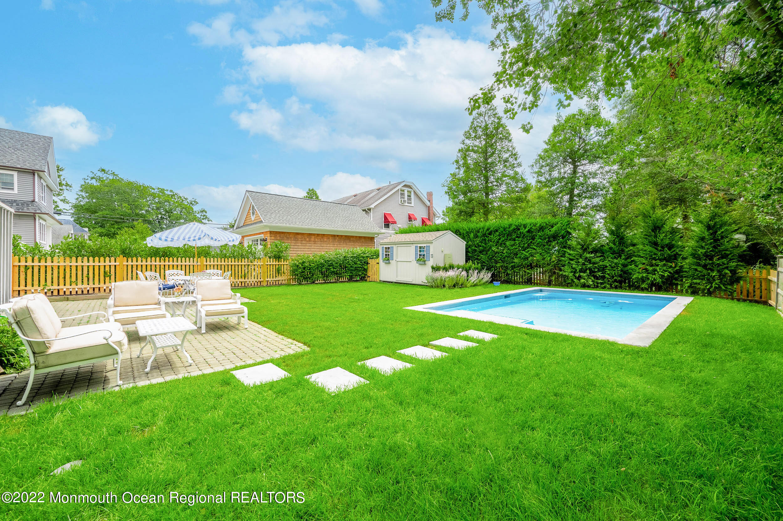 405 Salem Avenue Spring Lake, NJ 07762 - Photo 6 of 44 a front view of a house with garden
