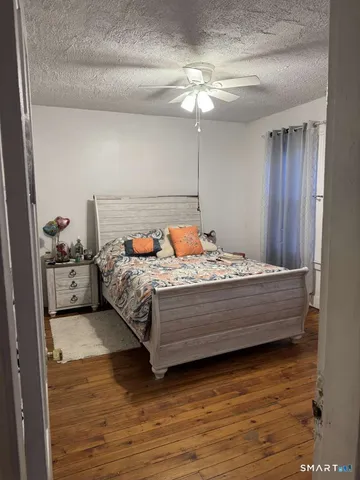 a bedroom with bed and window