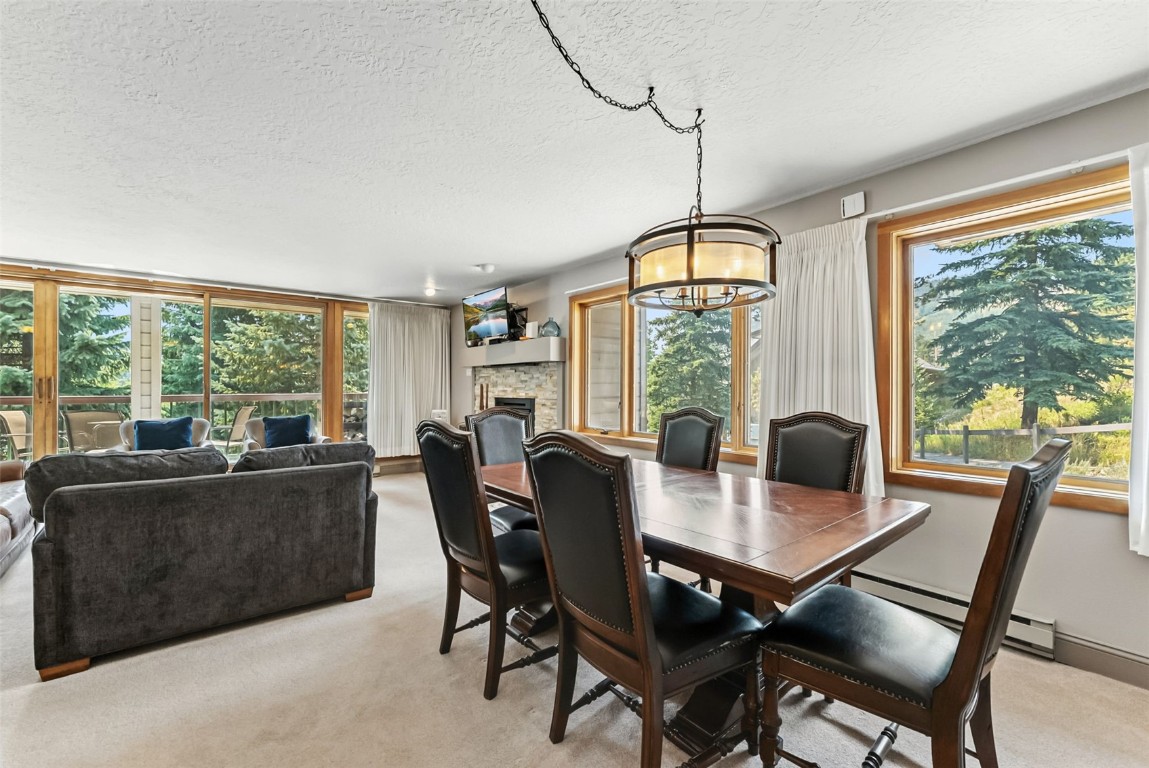 22300 Highway 6, Unit 1745 Keystone, CO 80435 - Photo 12 of 43 a view of a dining room with furniture window and outside view